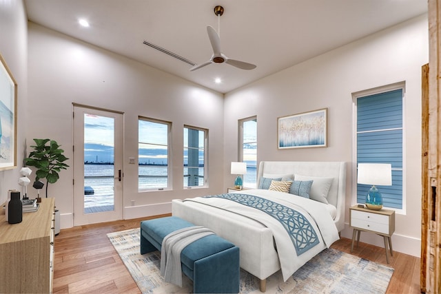 bedroom featuring recessed lighting, access to outside, and light wood-style flooring