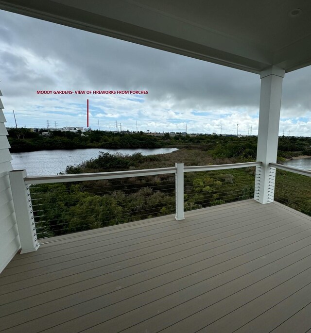 wooden deck featuring a water view