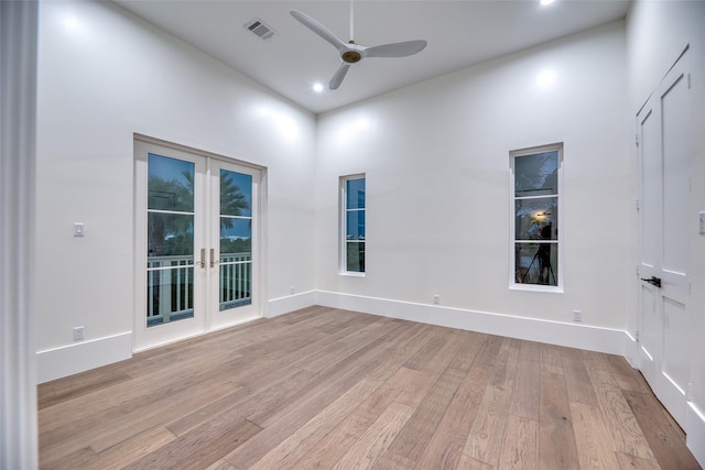 empty room with recessed lighting, light wood-style floors, visible vents, a ceiling fan, and french doors
