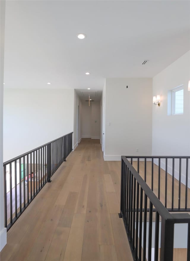 426 81st St, Galveston, TX 77554 - hall featuring attic access, light wood-style floors, recessed lighting, and baseboards