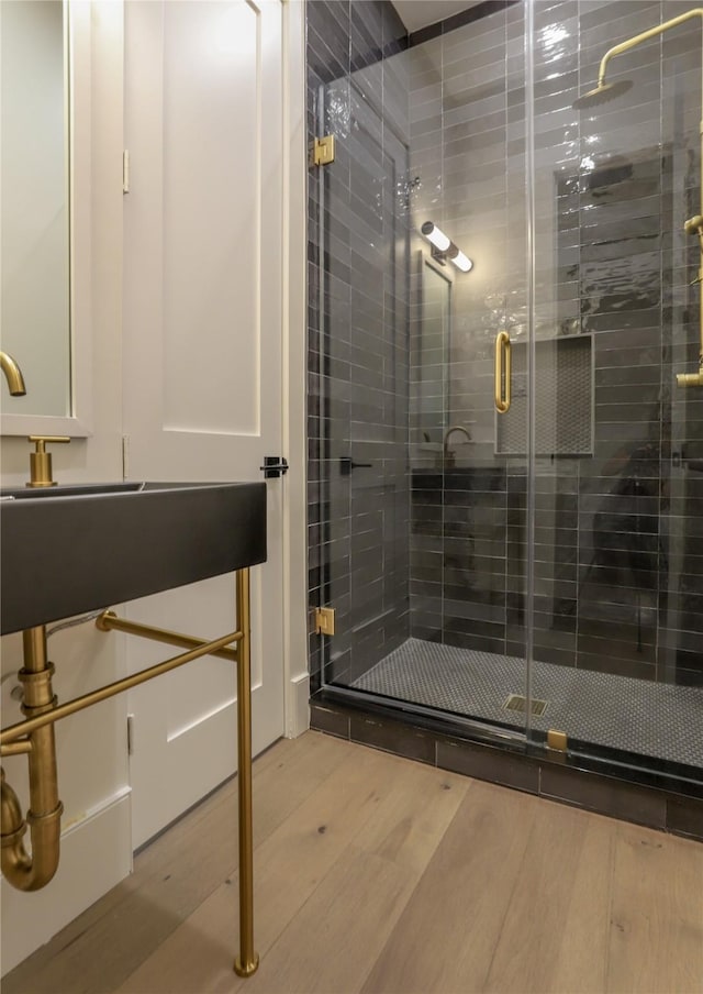 426 81st St, Galveston, TX 77554 - bathroom with a shower stall and wood finished floors