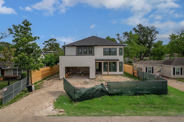 6510 Sivley St, Houston, TX 77055 - view of front of home featuring stucco siding and a fenced backyard