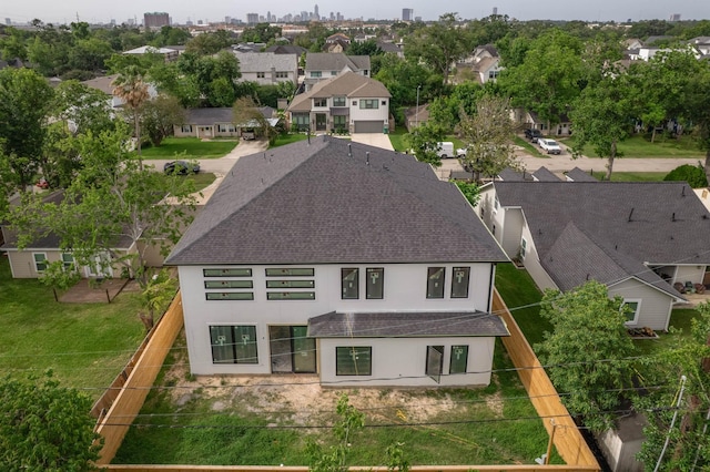 6510 Sivley St, Houston, TX 77055 - back of property with roof with shingles, a residential view, stucco siding, and a fenced backyard