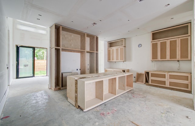 6510 Sivley St, Houston, TX 77055 - kitchen featuring concrete floors and a kitchen island