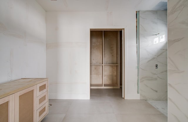 6510 Sivley St, Houston, TX 77055 - full bathroom with a marble finish shower and tile patterned flooring