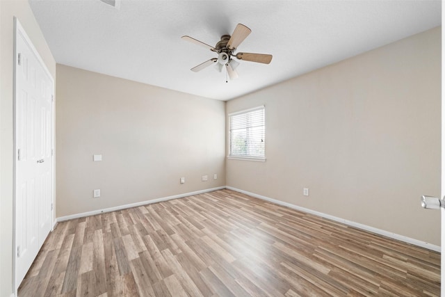 unfurnished bedroom featuring baseboards and light wood finished floors