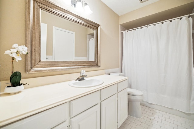 full bathroom featuring toilet, tile patterned flooring, and vanity