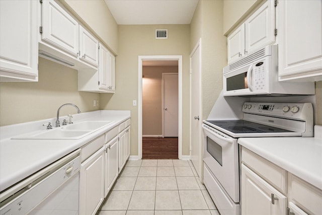 kitchen featuring white cabinetry, white appliances, light countertops, and a sink