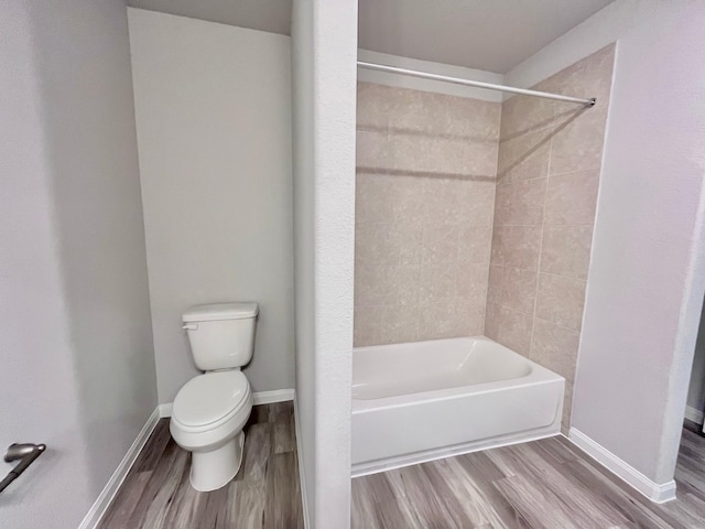 312 N Orange St, Sweeny, TX 77480 - bathroom featuring toilet, wood finished floors, shower / bath combination, and baseboards