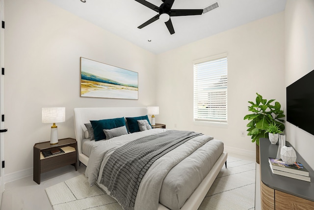 bedroom featuring baseboards, a ceiling fan, and visible vents