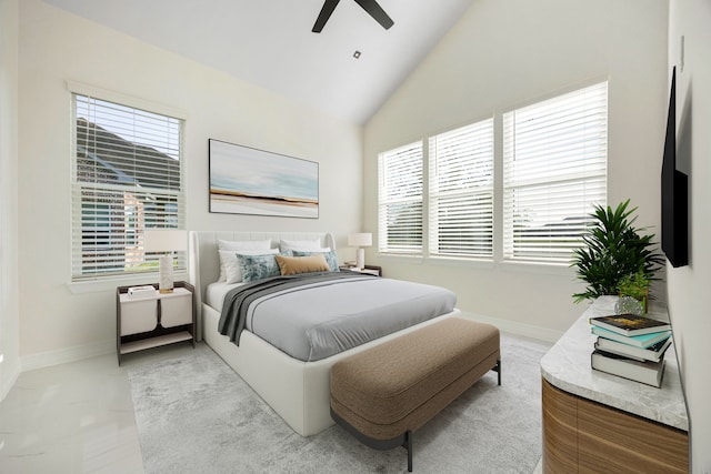 bedroom with baseboards, ceiling fan, and high vaulted ceiling