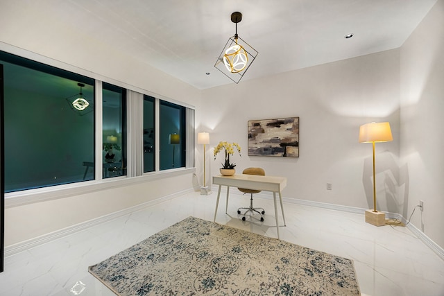 office area featuring baseboards and marble finish floor