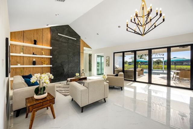 living area with wood walls, marble finish floor, a chandelier, and high vaulted ceiling