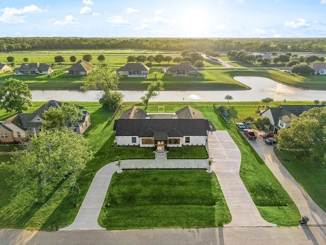 birds eye view of property with a residential view and a water view