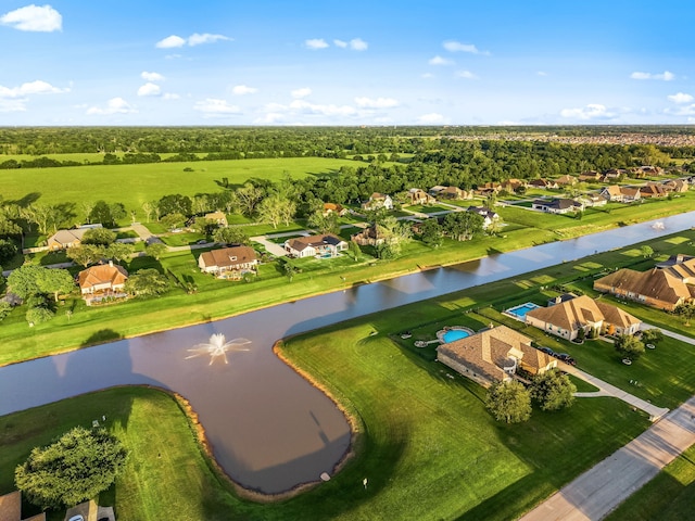 drone / aerial view featuring a water view and a residential view