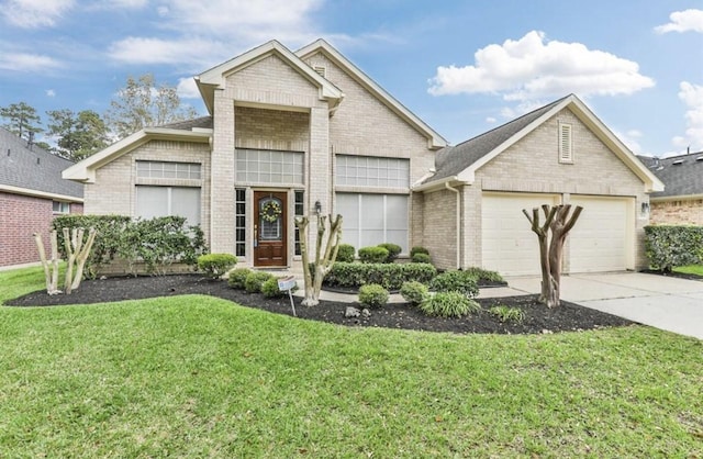 view of front of home with concrete driveway, brick siding, a front yard, and a garage