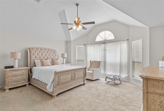 bedroom featuring lofted ceiling, a ceiling fan, baseboards, and light colored carpet
