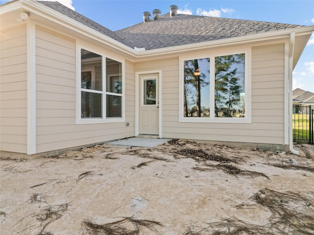 457 Shoreview Dr, Conroe, TX 77303 - view of exterior entry featuring a shingled roof