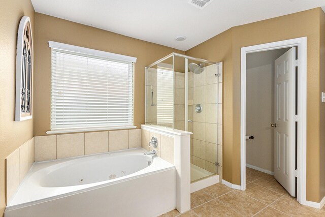 bathroom with a jetted tub, tile patterned floors, a stall shower, and visible vents