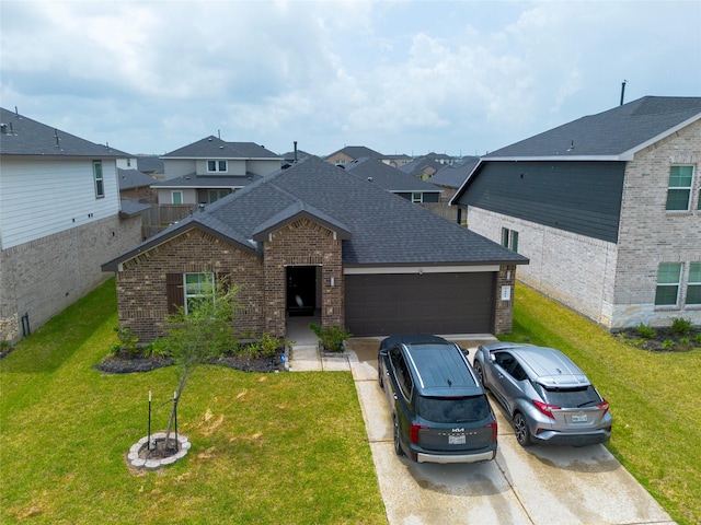 view of front of home with brick siding, a garage, driveway, roof with shingles, and a front lawn