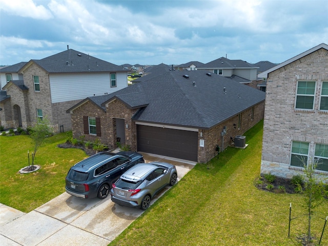 traditional home featuring driveway, brick siding, central air condition unit, and an attached garage