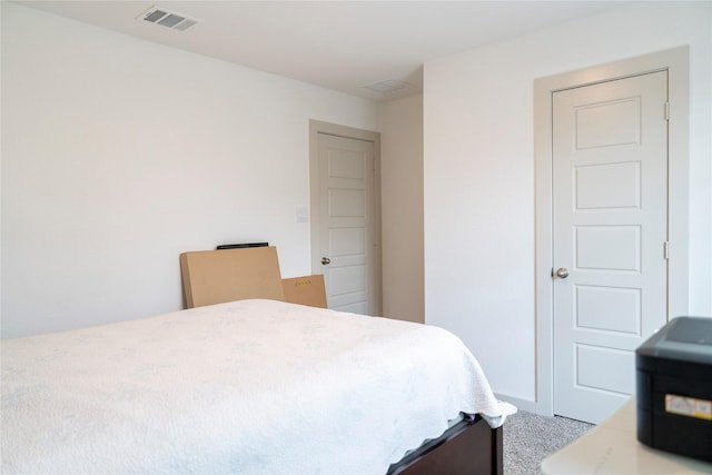 bedroom featuring carpet flooring and visible vents