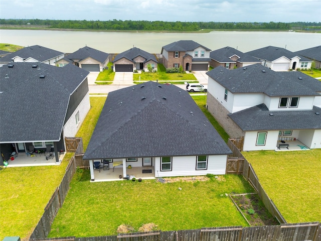 aerial view featuring a water view and a residential view