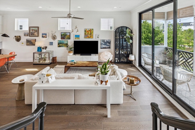 living room with recessed lighting, ceiling fan, crown molding, baseboards, and wood finished floors