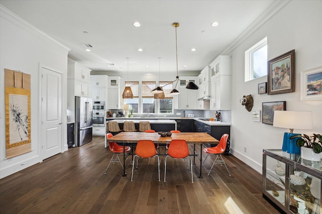 dining space with visible vents, baseboards, recessed lighting, ornamental molding, and dark wood-type flooring