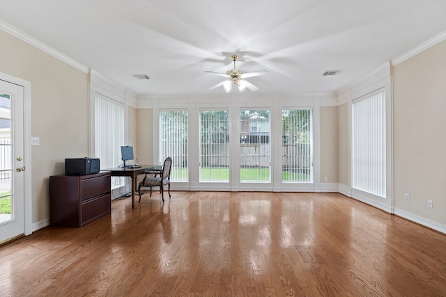 home office featuring visible vents, ornamental molding, a ceiling fan, and wood finished floors