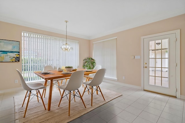 dining area featuring baseboards, light tile patterned floors, ornamental molding, and a notable chandelier