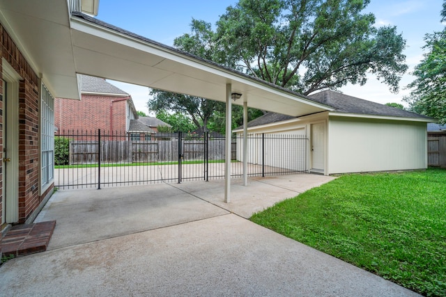 view of patio featuring an outbuilding and fence