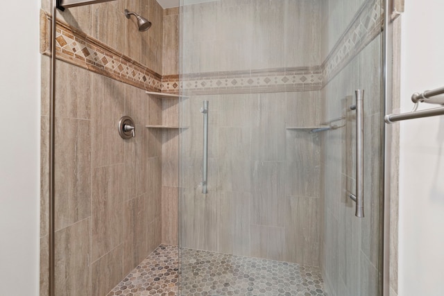 full bathroom with tiled shower