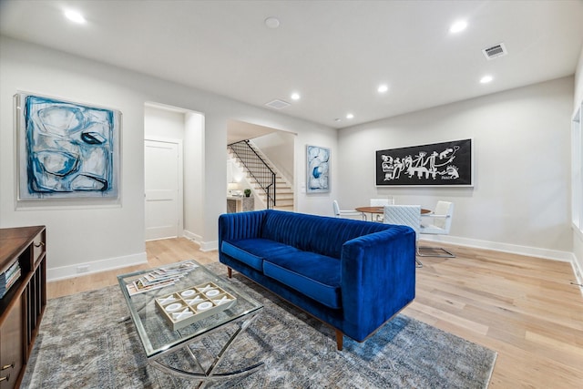 710 E 21st St, Houston, TX 77008 - living room with stairs, wood finished floors, and baseboards
