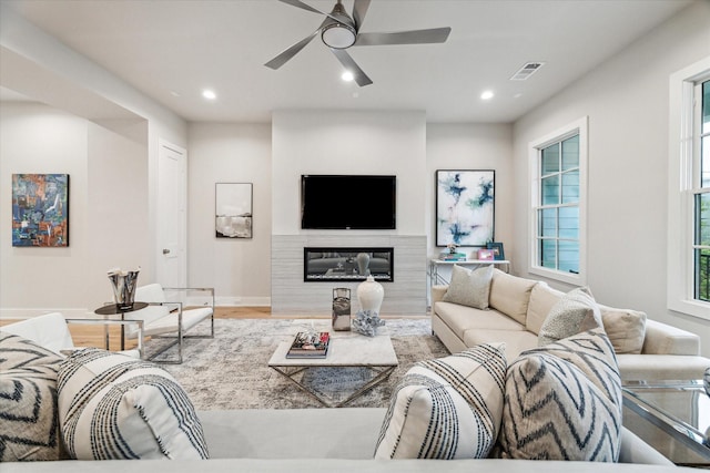 710 E 21st St, Houston, TX 77008 - living area featuring visible vents, a glass covered fireplace, recessed lighting, wood finished floors, and a ceiling fan