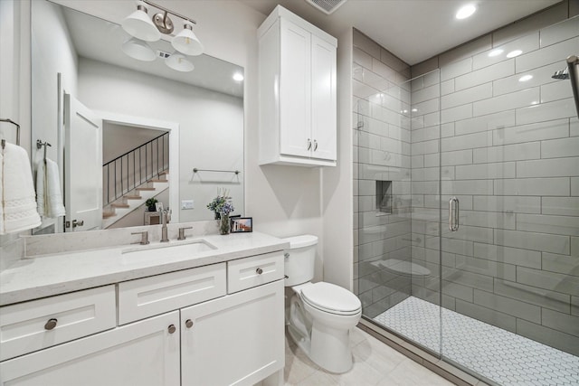 710 E 21st St, Houston, TX 77008 - bathroom with vanity, toilet, recessed lighting, and a stall shower