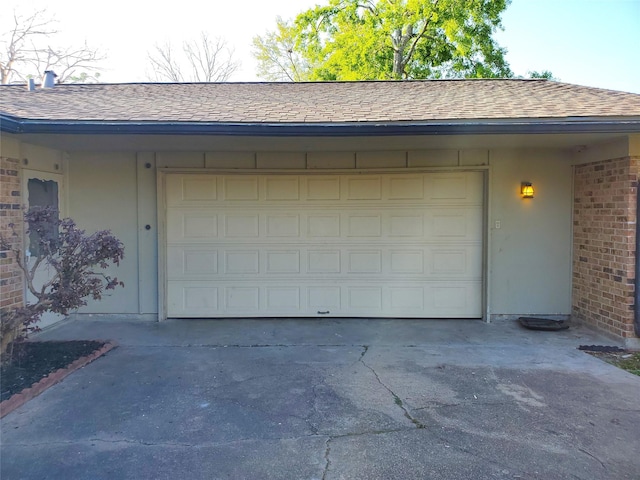 garage featuring driveway