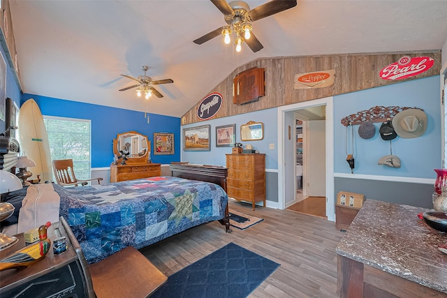 bedroom featuring wood finished floors, ceiling fan, and lofted ceiling