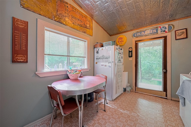 dining space featuring an ornate ceiling and baseboards