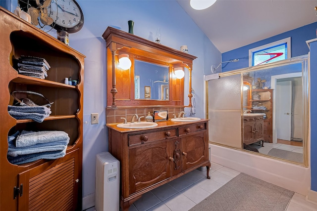 bathroom with tile patterned flooring, lofted ceiling, shower / bath combination with glass door, tasteful backsplash, and a sink