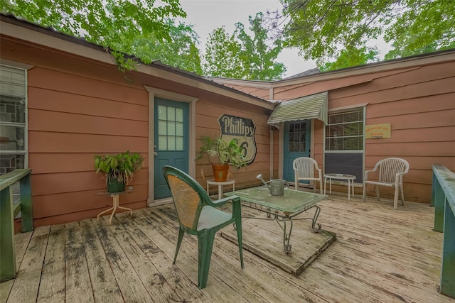 wooden deck with outdoor dining space