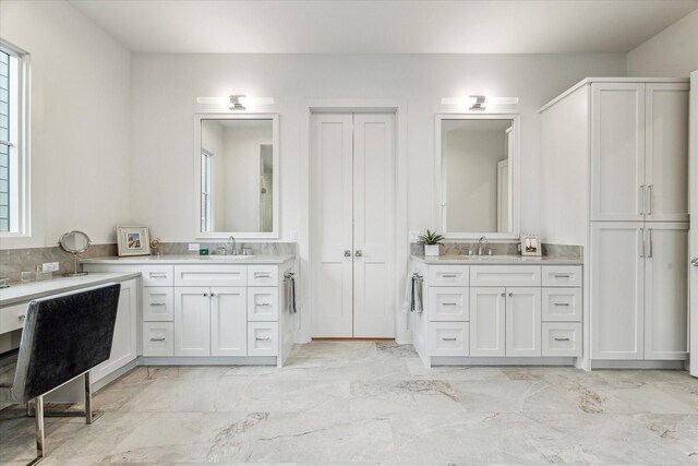 714 E 21st St, Houston, TX 77008 - bathroom featuring two vanities, marble finish floor, and a sink