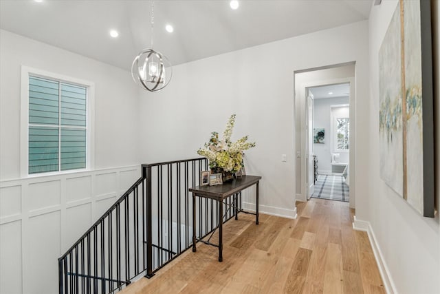 714 E 21st St, Houston, TX 77008 - hallway featuring recessed lighting, light wood-style flooring, an upstairs landing, baseboards, and a notable chandelier