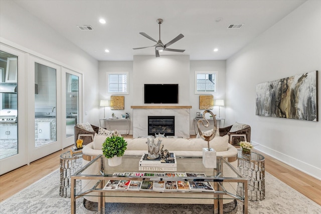 714 E 21st St, Houston, TX 77008 - living area featuring visible vents, wood finished floors, a healthy amount of sunlight, and ceiling fan