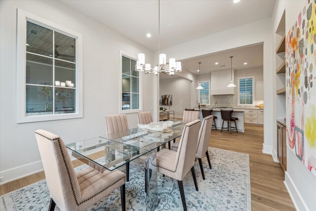 714 E 21st St, Houston, TX 77008 - dining space featuring a chandelier, baseboards, light wood-style flooring, and recessed lighting