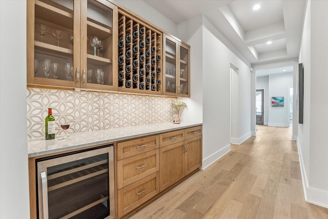 714 E 21st St, Houston, TX 77008 - bar with beverage cooler, backsplash, baseboards, light wood-type flooring, and a dry bar