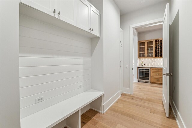 714 E 21st St, Houston, TX 77008 - mudroom with a dry bar, beverage cooler, light wood-style floors, and baseboards