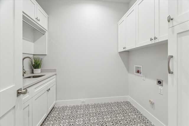 714 E 21st St, Houston, TX 77008 - laundry room with a sink, cabinet space, electric dryer hookup, hookup for a washing machine, and baseboards