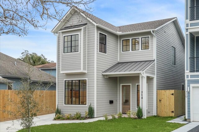714 E 21st St, Houston, TX 77008 - view of front of home with fence, a standing seam roof, metal roof, and a gate