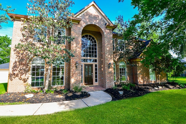 8819 Aubrey Ln, Richmond, TX 77469 - view of front of home featuring a front yard and brick siding